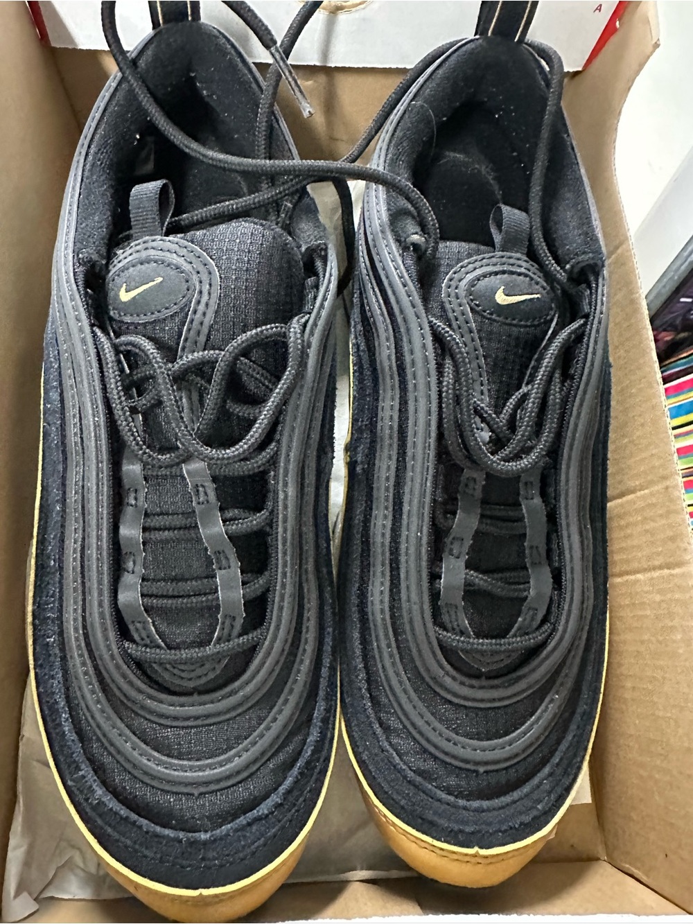 Nike Kids Black Sneakers with Gold Accents